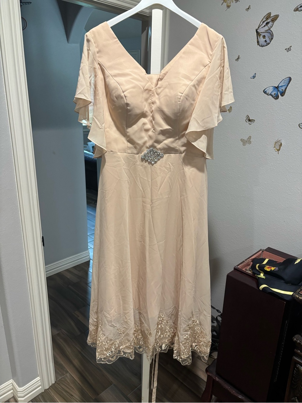 Elegant Cream V-Neck Flutter Sleeve Dress with Embellished Waist